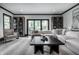 Bright living room featuring a neutral color scheme, stylish decor, and sliding doors to the patio at 1995 W 116Th St, Carmel, IN 46032