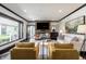 A stylish living room showcasing designer furniture, a modern fireplace, and an inviting atmosphere at 1995 W 116Th St, Carmel, IN 46032