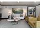 Bright living room with modern furniture, an abstract painting, and neutral color palette at 1995 W 116Th St, Carmel, IN 46032