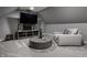 Modern living room with a TV mounted and furniture for relaxing and entertainment at 1995 W 116Th St, Carmel, IN 46032