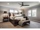 Comfortable main bedroom with a large bed, soft lighting, and relaxing decor at 1995 W 116Th St, Carmel, IN 46032