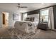Spacious main bedroom with a plush rug, a ceiling fan, and plenty of natural light at 1995 W 116Th St, Carmel, IN 46032