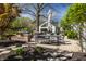 Outdoor kitchen and dining area with stone counters and stainless steel grill at 1995 W 116Th St, Carmel, IN 46032