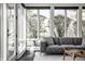 Bright sunroom with large windows showcasing the well-maintained yard and providing ample natural light at 1995 W 116Th St, Carmel, IN 46032