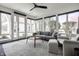 Inviting sunroom with many windows providing natural light and views of the landscaped backyard at 1995 W 116Th St, Carmel, IN 46032