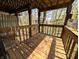 Cozy balcony with a scenic view of surrounding greenery and nearby houses at 21 Osage Ct, Columbus, IN 47201
