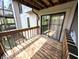Private balcony featuring sliding glass doors and a wooden railing, offering outdoor living at 21 Osage Ct, Columbus, IN 47201