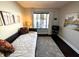 Well lit bedroom with decorative pillows, artwork, and dark wood flooring at 21 Osage Ct, Columbus, IN 47201