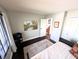 View of bedroom featuring wood floors, day bed, and serene wall art at 21 Osage Ct, Columbus, IN 47201