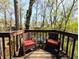 Enjoy outdoor living on this spacious deck with wicker furniture and privacy at 21 Osage Ct, Columbus, IN 47201