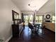 Elegant dining area with sliding doors to the deck and views of the living room at 21 Osage Ct, Columbus, IN 47201