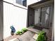 Covered home entrance with glass sliding doors and landscaping at 21 Osage Ct, Columbus, IN 47201