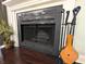 Close-up of fireplace with tools and decoratively furnished at 21 Osage Ct, Columbus, IN 47201