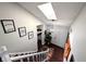 Bright foyer with a skylight, featuring modern lighting, stylish decor, and access to the home's front door and bedroom at 21 Osage Ct, Columbus, IN 47201