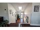 Bright foyer with skylight, stairway, hardwood floors, and decorative artwork; a welcoming entrance at 21 Osage Ct, Columbus, IN 47201