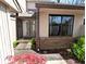 Charming front entrance with a brick accent and a storm door at 21 Osage Ct, Columbus, IN 47201