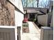 Landscaped walkway leading to the front entrance of a modern home with brick and siding at 21 Osage Ct, Columbus, IN 47201