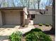Exterior of modern home with attached garage, landscaped walkway, and a well maintained lawn at 21 Osage Ct, Columbus, IN 47201
