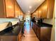 Spacious kitchen featuring lots of storage and dark countertops, plus built in office space at 21 Osage Ct, Columbus, IN 47201
