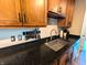Granite countertop features stainless sink and faucet and knife rack at 21 Osage Ct, Columbus, IN 47201