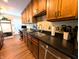 Kitchen granite countertop boasts stainless steel sink and faucet, as well as stainless dishwasher at 21 Osage Ct, Columbus, IN 47201