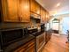 Appliances featured in updated kitchen; wood cabinets, granite countertops and tile flooring at 21 Osage Ct, Columbus, IN 47201