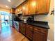 Spacious kitchen with wood cabinets, stainless steel appliances, and dark countertops for modern cooking at 21 Osage Ct, Columbus, IN 47201
