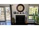Living room showcasing fireplace, decorative mantle, and sliding glass doors to outdoor deck at 21 Osage Ct, Columbus, IN 47201