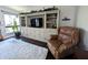 Comfortable living room featuring a large entertainment center and natural light at 21 Osage Ct, Columbus, IN 47201