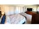Carpeted main bedroom with ensuite bathroom and plentiful closet space at 21 Osage Ct, Columbus, IN 47201