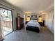 Bright main bedroom featuring a balcony, soft carpet, and decorative accents at 21 Osage Ct, Columbus, IN 47201
