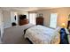 Large main bedroom featuring soft carpet, a large dresser and an ensuite bathroom at 21 Osage Ct, Columbus, IN 47201