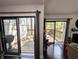 View of dual sliding glass doors leading to outside decks with wooded views at 21 Osage Ct, Columbus, IN 47201