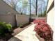 A walkway and landscaping around the house with trashcans in view at 21 Osage Ct, Columbus, IN 47201
