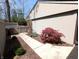 A walkway and landscaping around the side of the house at 21 Osage Ct, Columbus, IN 47201