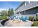 Spacious backyard features a patio area with fire pit and ample seating at 2261 Mustang Chase Dr, Carmel, IN 46074