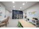 Finished basement featuring a play area, with a large bookshelf and table with green chairs at 2261 Mustang Chase Dr, Carmel, IN 46074
