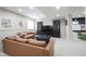 Finished basement featuring a comfortable seating area with large couches and dark display cabinets at 2261 Mustang Chase Dr, Carmel, IN 46074