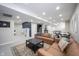 Spacious finished basement with seating area, kitchenette, ping pong table and play area at 2261 Mustang Chase Dr, Carmel, IN 46074