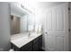 Well-lit bathroom features a vanity, mirror, and neutral decor with a door to a linen closet at 2261 Mustang Chase Dr, Carmel, IN 46074