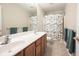 Bathroom with a double sink vanity, large mirror and a shower/tub with a colorful, fish-themed shower curtain at 2261 Mustang Chase Dr, Carmel, IN 46074