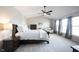 Main bedroom featuring high ceilings, a ceiling fan, and light-colored carpet at 2261 Mustang Chase Dr, Carmel, IN 46074