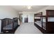 Bright bedroom with ceiling fan, carpet, bunk beds and crib at 2261 Mustang Chase Dr, Carmel, IN 46074