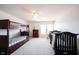 Bright bedroom with ceiling fan, carpet, bunk beds and crib at 2261 Mustang Chase Dr, Carmel, IN 46074