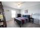 Bedroom with a dark wood bed frame, ceiling fan, carpet, and a window providing natural light at 2261 Mustang Chase Dr, Carmel, IN 46074