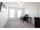 Bedroom with carpet, two windows providing natural light and a dark desk area for a functional workspace at 2261 Mustang Chase Dr, Carmel, IN 46074
