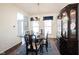 Traditional dining room showcasing a chandelier, china cabinet, and large windows at 2261 Mustang Chase Dr, Carmel, IN 46074
