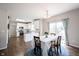Eat-in kitchen, adjacent dining, and large windows make this space feel open and airy at 2261 Mustang Chase Dr, Carmel, IN 46074