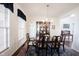 Traditional dining room showcasing a chandelier, china cabinet, and large windows at 2261 Mustang Chase Dr, Carmel, IN 46074
