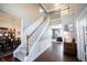 Elegant foyer with a staircase, hardwood floors, and tasteful decor, creating a grand entrance at 2261 Mustang Chase Dr, Carmel, IN 46074
